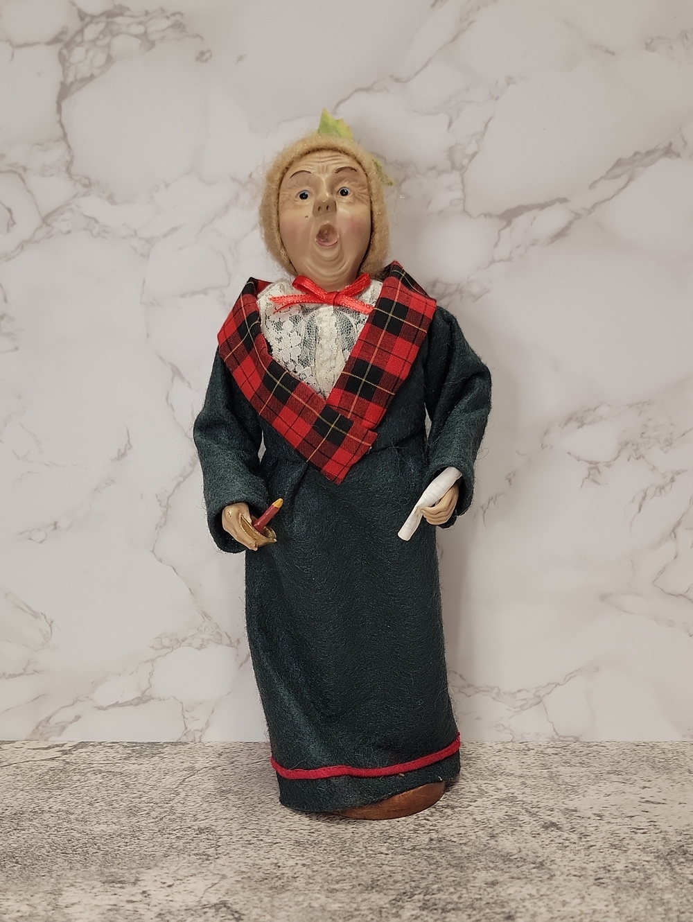 intage Holiday Caroler‑Style Figurine in Green Coat with Plaid Trim